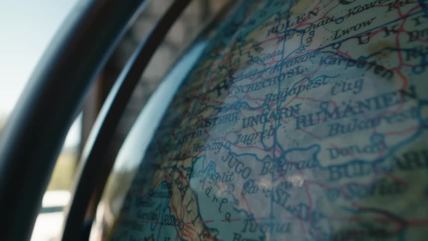 A detailed close-up shot of a vintage globe focusing on a map of European countries