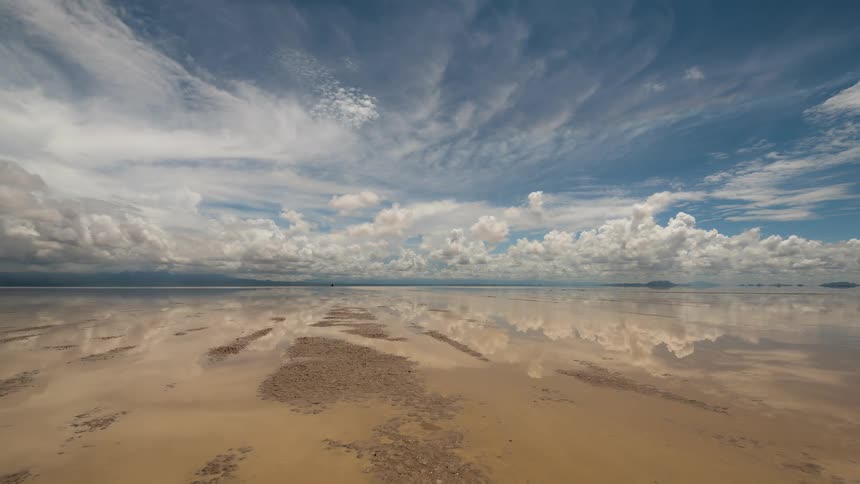 A surreal time-lapse shows majestic clouds perfectly reflected on the flooded Uyuni Salt Flats in Bolivia