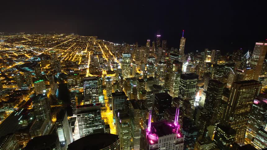 A stunning high-angle time-lapse reveals the glittering expanse of the Chicago cityscape as night falls