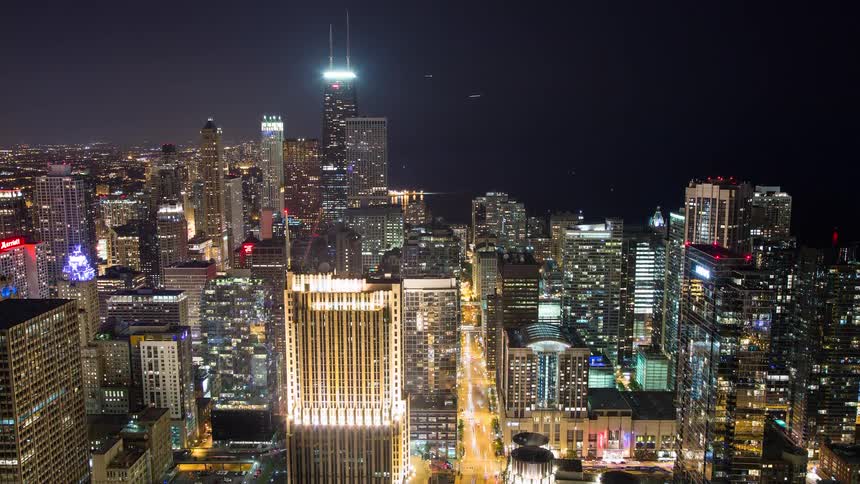 A stunning time-lapse of the Chicago skyline at night shows bustling traffic and glowing skyscrapers under a dark sky