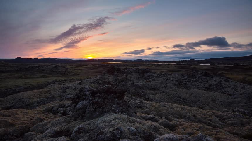 A beautiful timelapse of the sun setting over the vast, moss-covered volcanic lava fields of Iceland