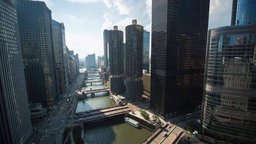 Stunning 24-hour time-lapse captures the transition from night to day to night over the bustling Chicago River and iconic cityscape
