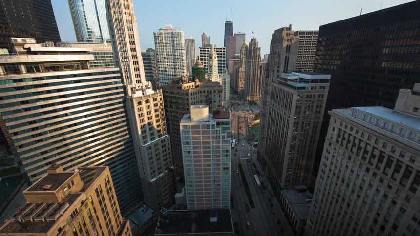 A breathtaking night-to-day timelapse captures the vibrant energy of Chicago's city streets as the sun rises over the iconic urban skyline
