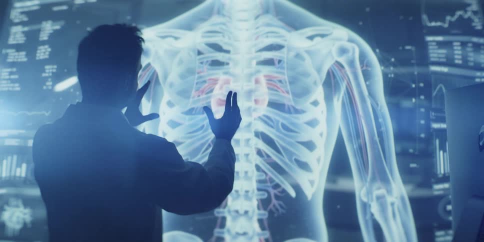 A doctor interacts with a futuristic holographic display showing a 3D model of the human skeletal and cardiovascular system