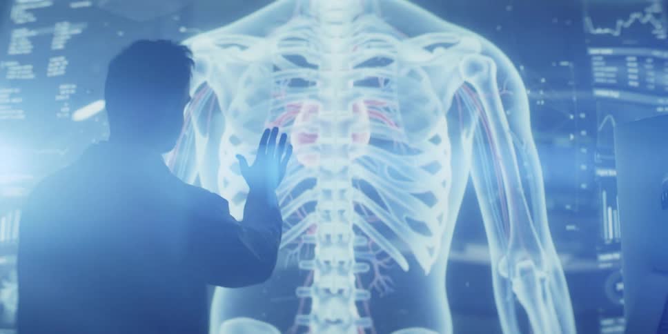 A doctor examines a futuristic holographic display of the human anatomy, rotating and zooming in on the heart