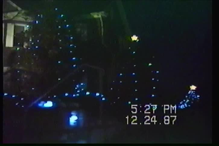 A vintage VHS tour of charming outdoor Christmas light displays and decorations from Christmas Eve 1987