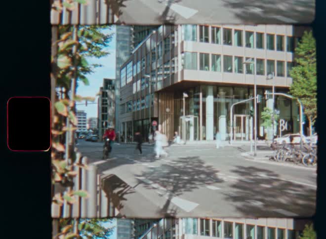 Multi-image prism lens effect on a vintage film time-lapse of a busy city intersection