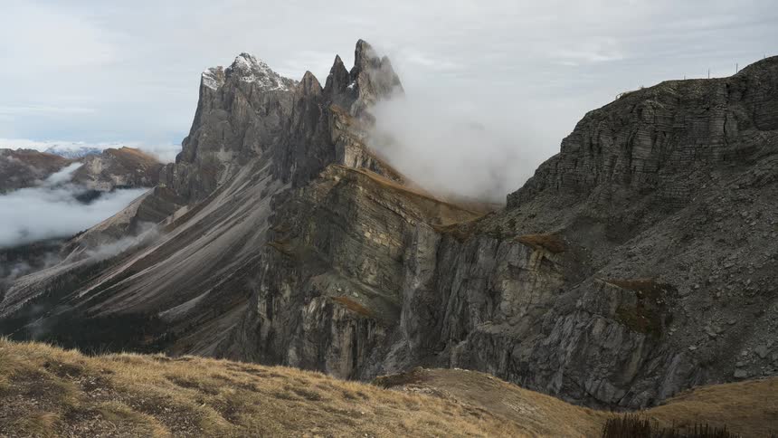 Time-lapse of dramatic clouds moving swiftly over the iconic Seceda mountain peaks in the Italian Dolomites