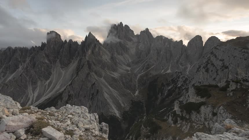 A stunning time-lapse of the dramatic Cadini di Misurina mountain range in the Dolomites as clouds drift by at sunset