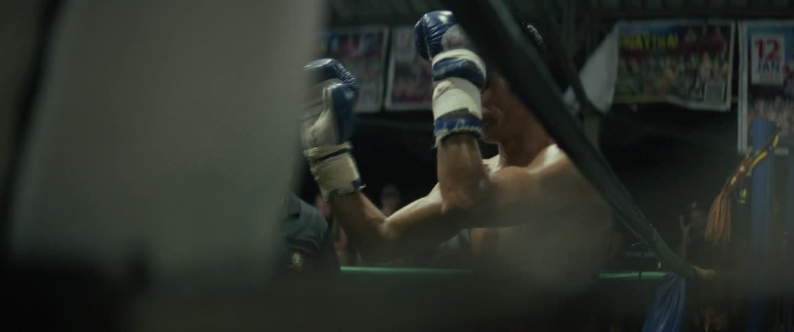 A Muay Thai fighter performs a traditional Wai Khru dance before a match where he gets knocked out in slow motion
