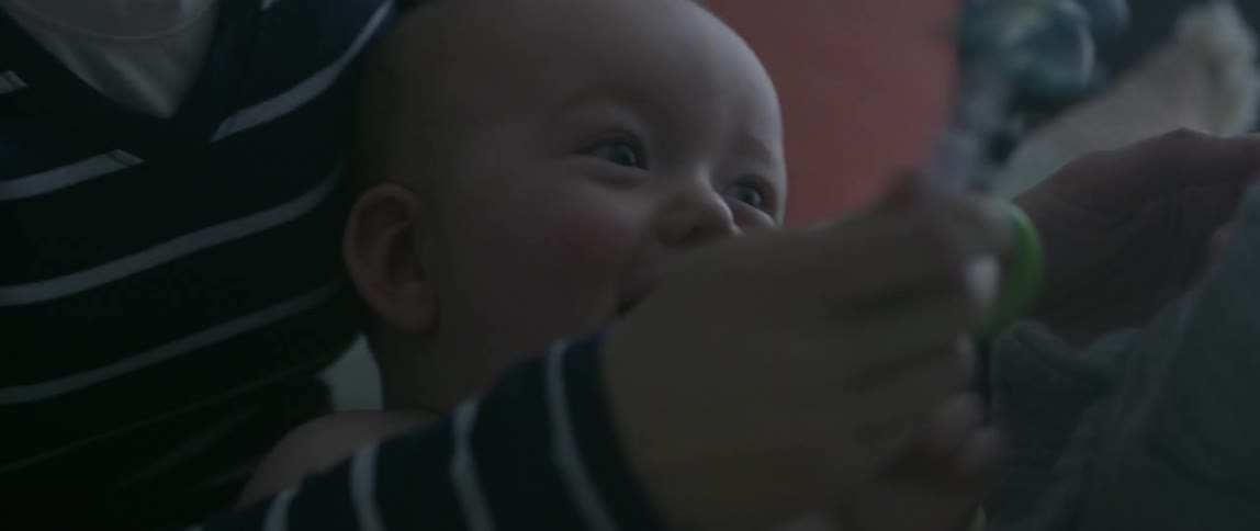 Woman talks to a smiling baby