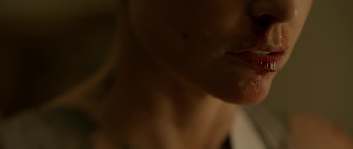 A woman's lip is bleeding