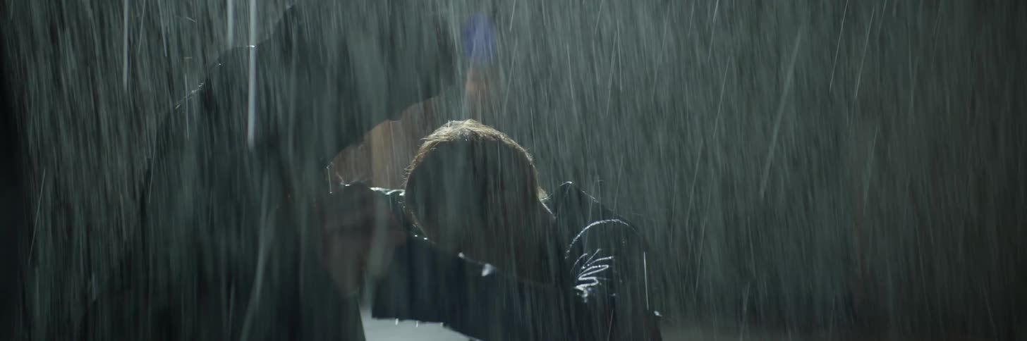 Two men fight in the rain