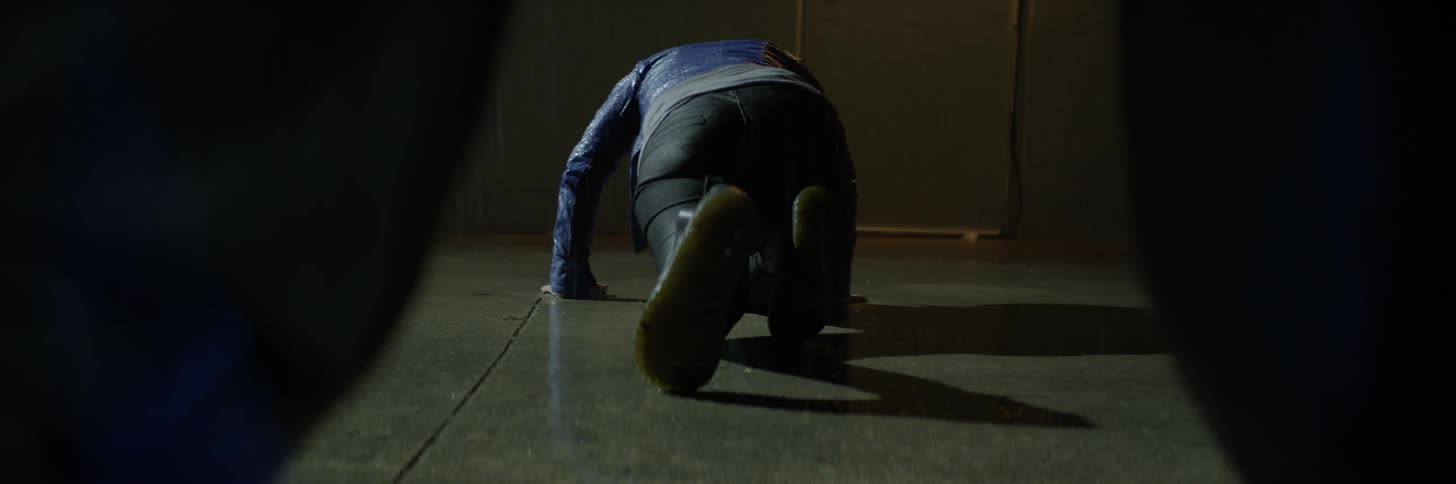 Person stretching on the floor gets up