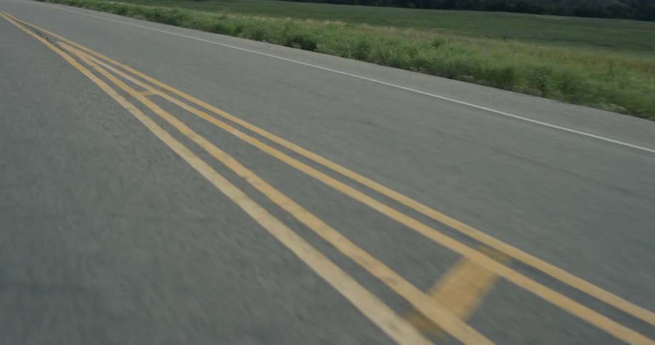 The road is empty with yellow lines in the middle