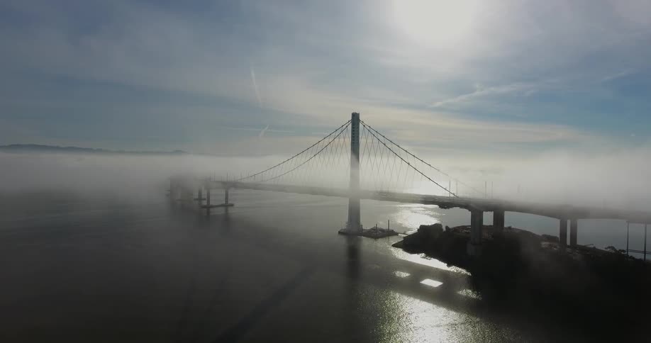 The bridge is covered with thick fog