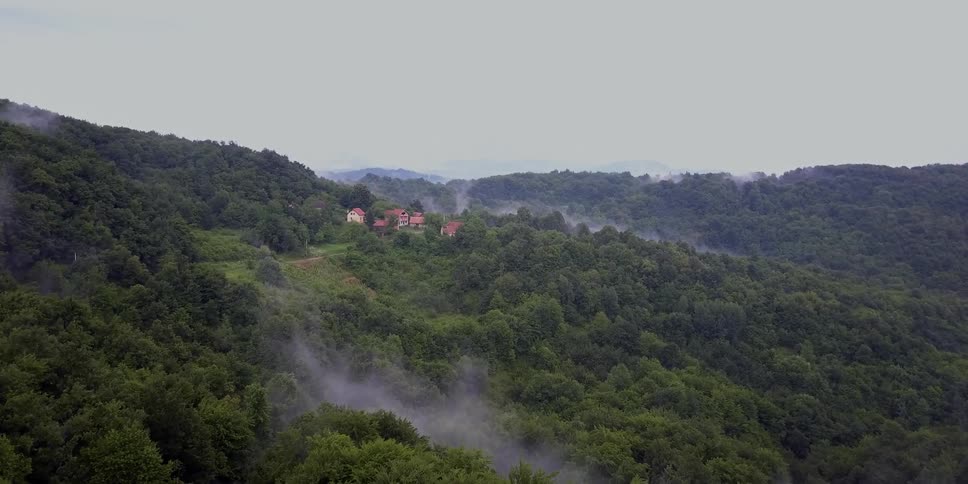 Smoke rising in different parts of a mountain range