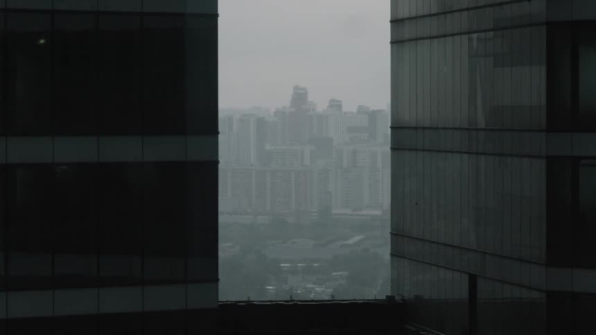 The city ahead has fog over it