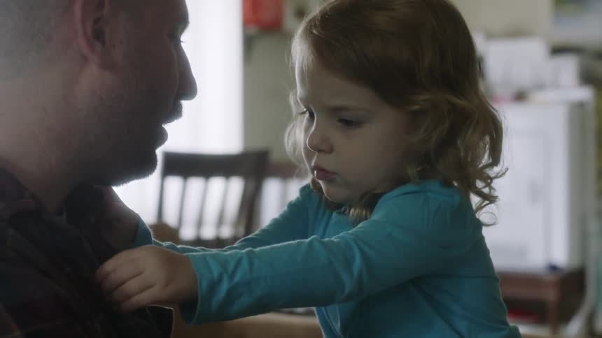 Man talks to a small child