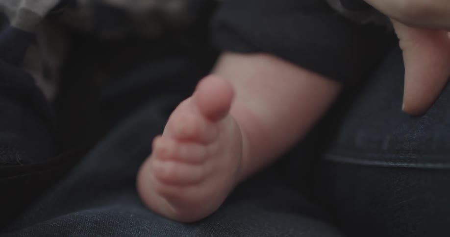 A baby's foot is shown
