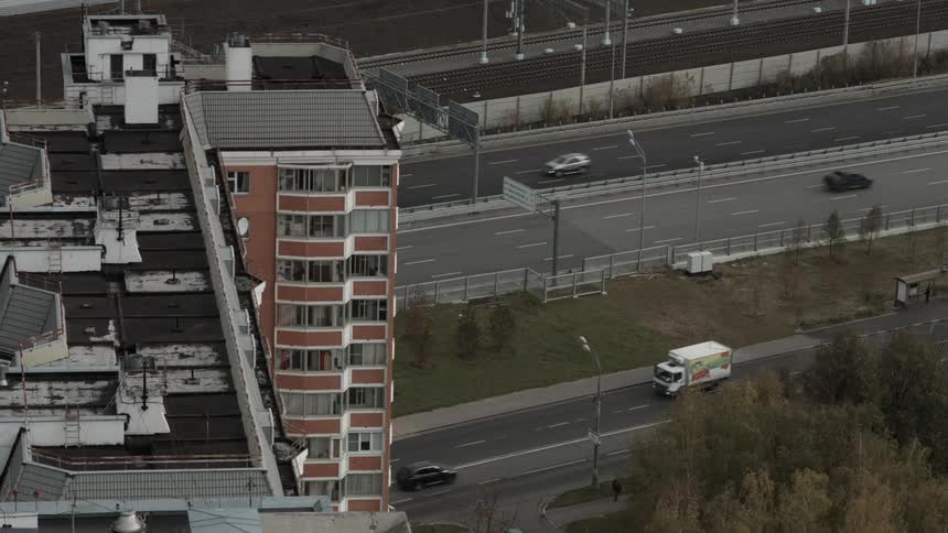 Cars drive on a city highway