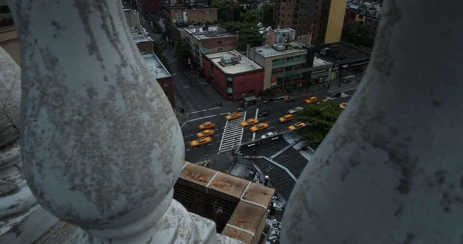 Time lapse of cars driving down a street in a busy city