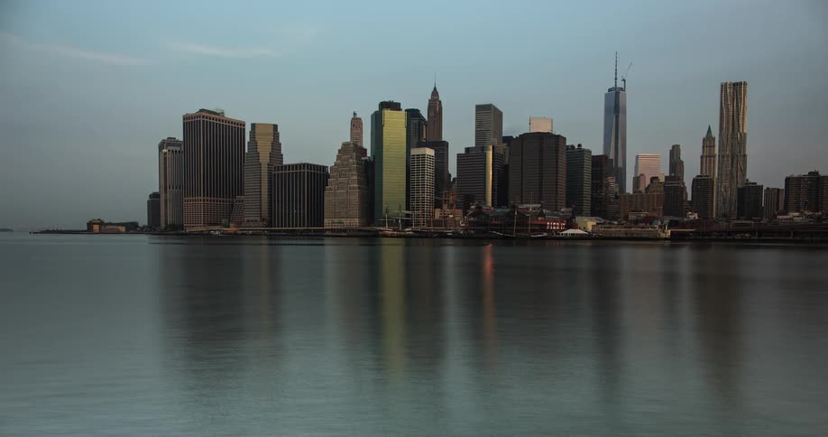 Time-lapse of a large city across the water