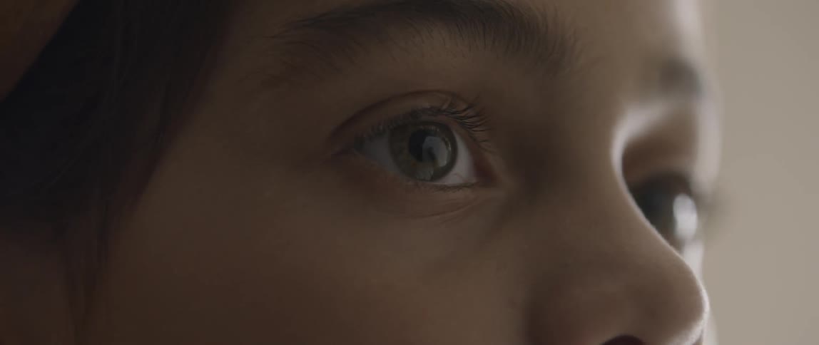 A person is shifting their gaze from side to side
