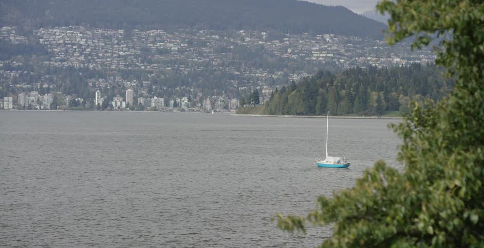 Boat floating on a city lake