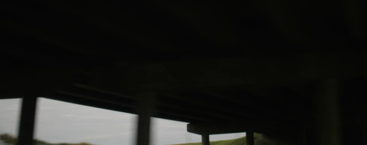 Traveling view on a highway going under a bridge