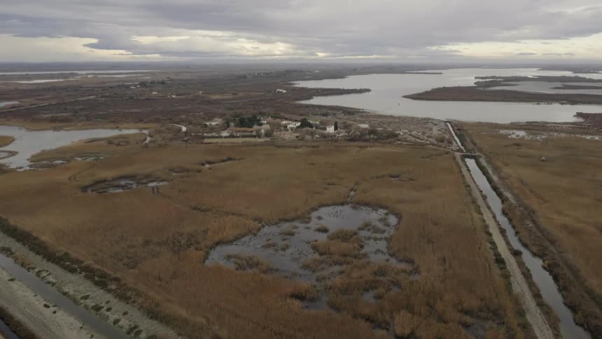 The fields below have water and small roads running around
