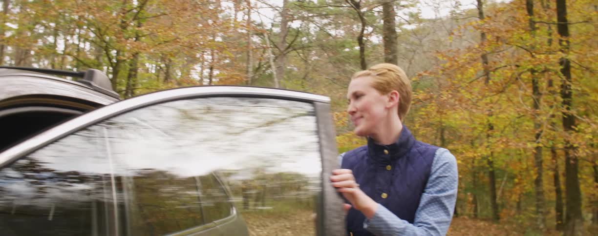 A woman gets out of the car