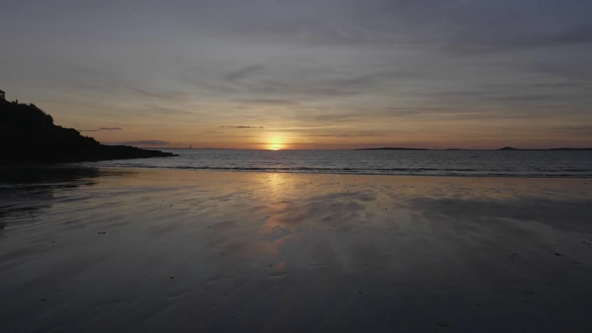 The beach and ocean at sunset