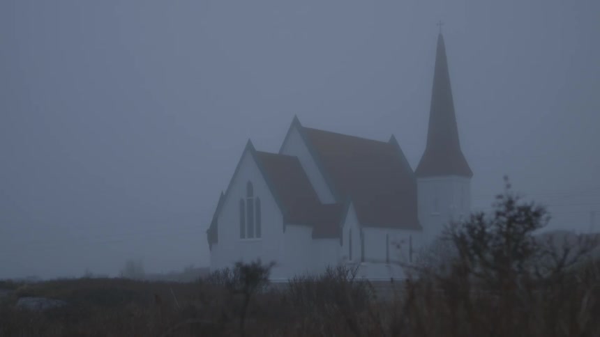 View of a church on a foggy overcast day