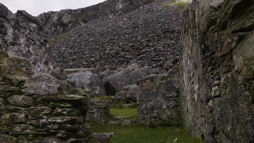 Stone ruins cover a grassy area