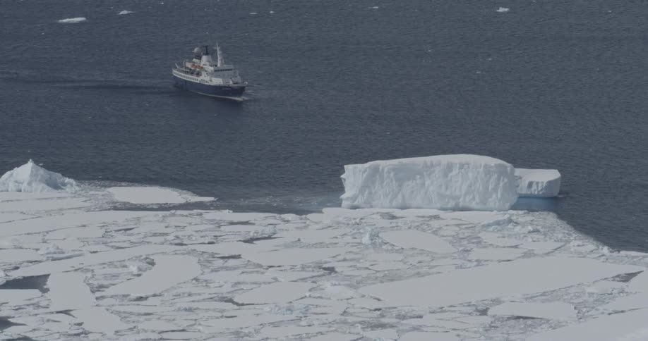 A ship is making its way through ice