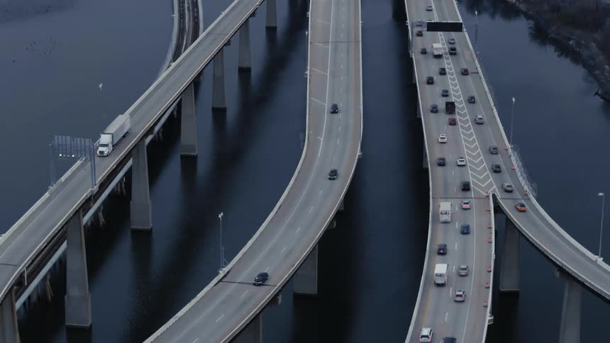 Vehicles driving on a bridge over a river