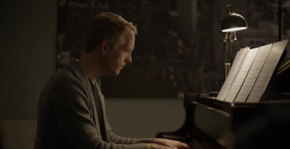 A man plays a piano