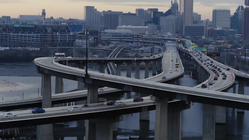 Cars drive on a city highway system