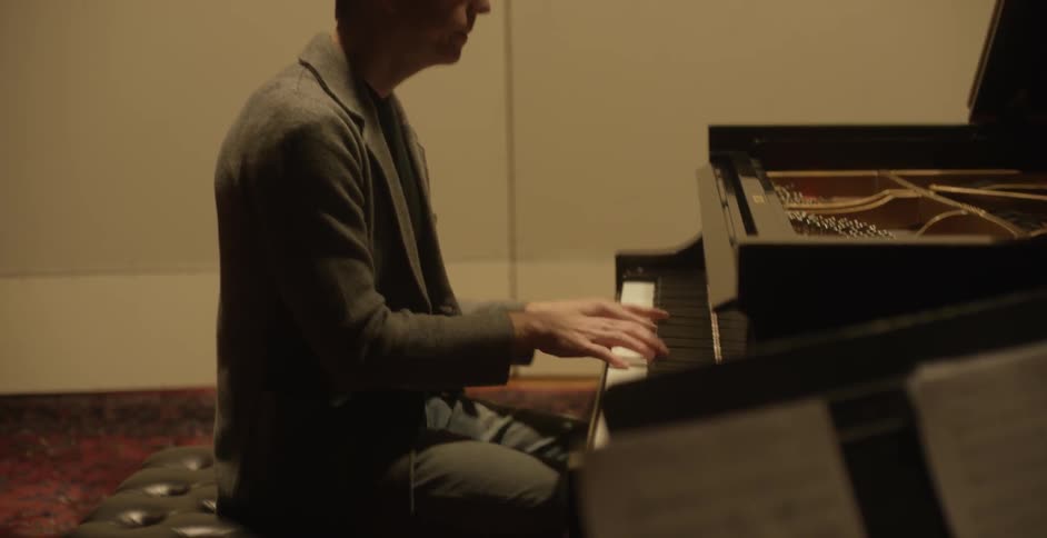 A man plays a piano
