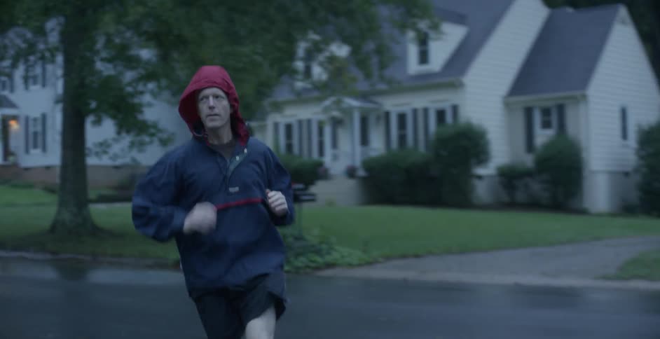 A man jogs in the rain