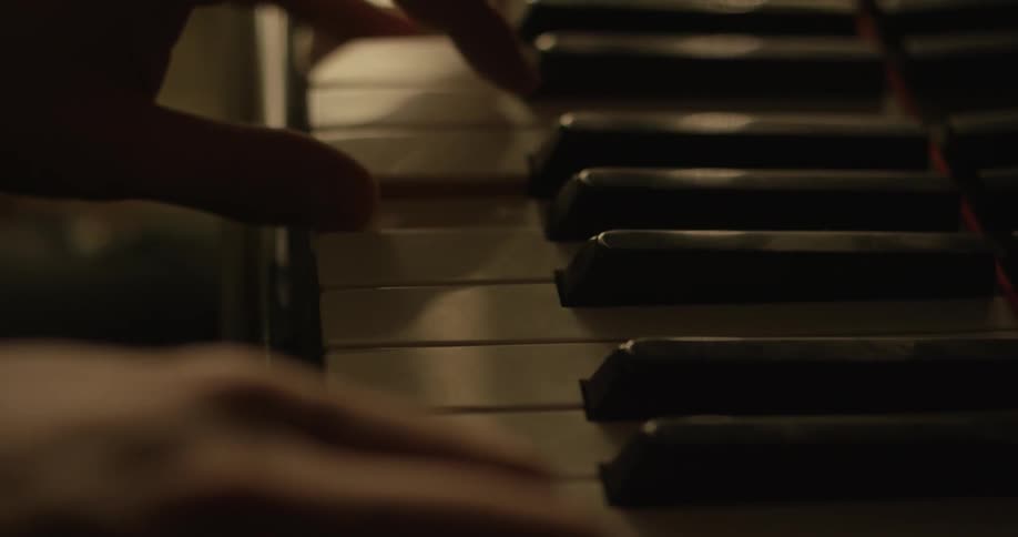 Close up of person playing the piano