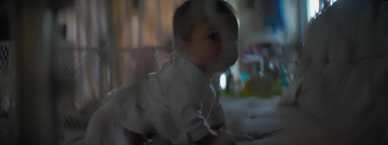 Baby crawling down from couch backwards