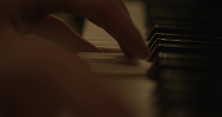 Close up of person playing the piano