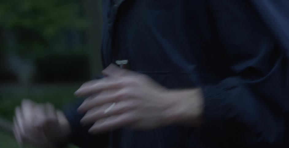 Person jogs outside at dusk