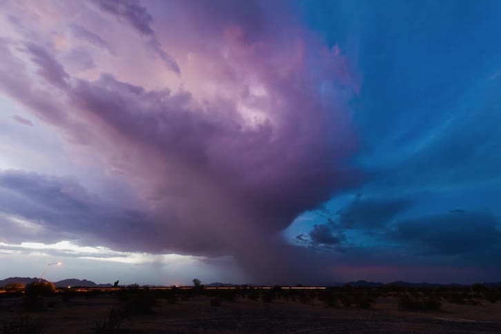 Lightning is flashing in the large storm clouds