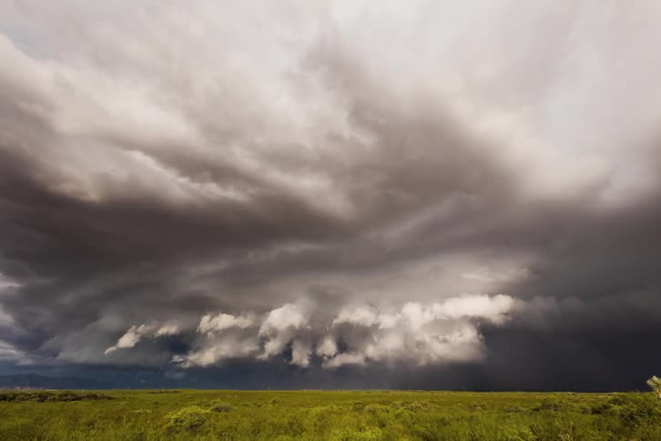 Storm clouds rolling over flat plains