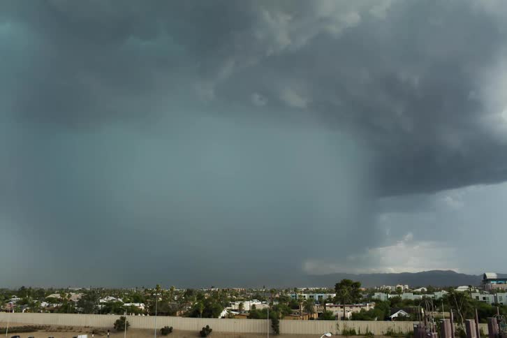 Rain clouds rolling over a city