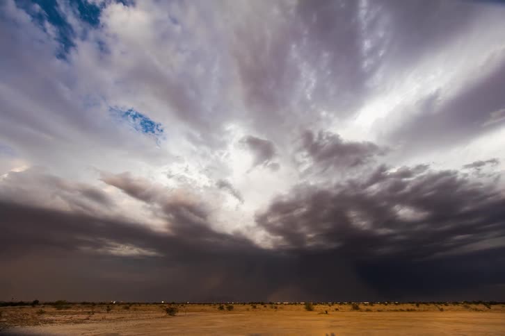 Clouds build over a desert