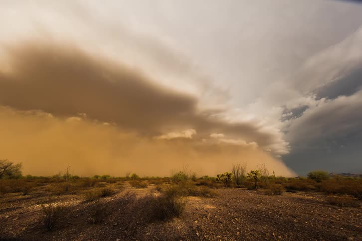 The large clouds roll over the landscape ahead